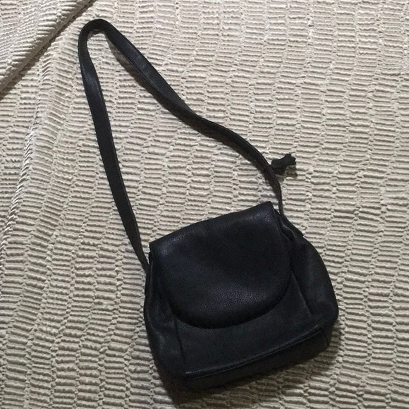 Black leather purse. Four separate pockets. Magnetic closure. 10”x11” - Picture 1 of 5